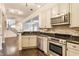 Modern kitchen features stainless steel appliances, dark granite countertops, and tile backsplash at 355 E Ohio St # 314, Indianapolis, IN 46204