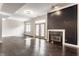 Bright open-concept living room featuring a fireplace, hardwood floors, and ample natural light at 355 E Ohio St # 314, Indianapolis, IN 46204