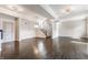 Bright open-concept living room featuring a hardwood floors, staircase and ample natural light at 355 E Ohio St # 314, Indianapolis, IN 46204