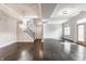 Bright open-concept living room featuring a hardwood floors, staircase and ample natural light at 355 E Ohio St # 314, Indianapolis, IN 46204