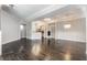 Spacious living area featuring open floor plan, hardwood flooring, recessed lighting, and adjacent kitchen at 355 E Ohio St # 314, Indianapolis, IN 46204
