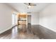 Open concept living area with hardwood floors and natural light, featuring a wet bar and ceiling fan at 355 E Ohio St # 314, Indianapolis, IN 46204