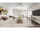Modern living room with hardwood floors, stylish furniture, access to a balcony, and plenty of natural light at 355 E Ohio St # 314, Indianapolis, IN 46204