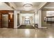 Elegant lobby with travertine floors, modern lighting, elevator access, and seating at 355 E Ohio St # 314, Indianapolis, IN 46204