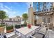 Rooftop patio boasting an outdoor fireplace, elegant pergola, dining area, and city views at 355 E Ohio St # 314, Indianapolis, IN 46204