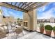 Charming rooftop terrace with outdoor fireplace, lounge seating, and potted plants at 355 E Ohio St # 314, Indianapolis, IN 46204