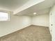 Finished basement with fresh paint, new carpet, and bright lighting, perfect for extra living space at 3640 Breen Dr, Indianapolis, IN 46235