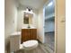 The bathroom has wood cabinets and vinyl flooring at 3640 Breen Dr, Indianapolis, IN 46235