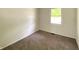 Bedroom featuring neutral decor, carpet flooring, and a bright window for natural light at 3640 Breen Dr, Indianapolis, IN 46235