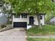 Charming home featuring a one-car garage and a well-maintained front yard at 3640 Breen Dr, Indianapolis, IN 46235