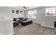 Comfortable bonus room featuring a large sectional sofa, ottoman, and natural light from bright windows at 4032 Stubbington Ln, Indianapolis, IN 46239