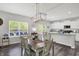 Dining area with sliding doors to the backyard and kitchen with stainless appliances at 4032 Stubbington Ln, Indianapolis, IN 46239
