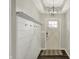 Welcoming entryway features a coat rack and stylish light fixture at 4032 Stubbington Ln, Indianapolis, IN 46239