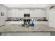 Kitchen featuring a large island, stainless steel appliances, and ample counter space at 4032 Stubbington Ln, Indianapolis, IN 46239