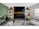 Cozy living room with a fireplace and custom-built shelves at 4032 Stubbington Ln, Indianapolis, IN 46239