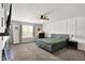Spacious primary bedroom with a ceiling fan, neutral walls, decorative wall trim and a large window at 4032 Stubbington Ln, Indianapolis, IN 46239