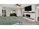 Main bedroom with a fireplace, flat-screen television, and neutral color palette at 4032 Stubbington Ln, Indianapolis, IN 46239