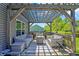 Inviting covered patio featuring modern outdoor furniture, perfect for enjoying the outdoors at 4032 Stubbington Ln, Indianapolis, IN 46239
