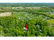 Aerial view of the property shows its lush green landscaping and desirable location at 4128 Whitetail Woods Dr, Bargersville, IN 46106