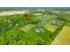 Aerial view showing a neighborhood with a tree-lined property and large lots in a serene environment at 4128 Whitetail Woods Dr, Bargersville, IN 46106