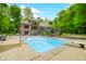 Backyard featuring a pool, waterfall features, and a deck with stairs at 4128 Whitetail Woods Dr, Bargersville, IN 46106
