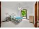 Bright bedroom with a large arched window and a decorative metal bed frame at 4128 Whitetail Woods Dr, Bargersville, IN 46106