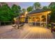 Exterior view of the deck featuring outdoor seating and a screened-in porch at 4128 Whitetail Woods Dr, Bargersville, IN 46106