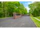 Gated entrance with brick pillars and manicured landscaping at 4128 Whitetail Woods Dr, Bargersville, IN 46106