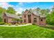 Charming brick home featuring lush landscaping and a welcoming entrance at 4128 Whitetail Woods Dr, Bargersville, IN 46106