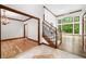 Elegant foyer with hardwood flooring, chandelier, and a staircase leading to the upper level at 4128 Whitetail Woods Dr, Bargersville, IN 46106