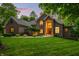 Stately brick home with well-manicured lawn and lush landscaping at 4128 Whitetail Woods Dr, Bargersville, IN 46106