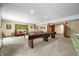 Finished basement game room with ping pong table and shuffleboard at 4128 Whitetail Woods Dr, Bargersville, IN 46106