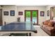 Finished basement game room with ping pong table, shuffleboard and access to the pool at 4128 Whitetail Woods Dr, Bargersville, IN 46106