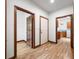 Hallway featuring three doors, connecting the home's various rooms and living spaces at 4128 Whitetail Woods Dr, Bargersville, IN 46106