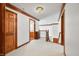 Upstairs hallway with wood trim, a staircase, and doors to the bedrooms and bathrooms at 4128 Whitetail Woods Dr, Bargersville, IN 46106
