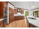 Gourmet kitchen with white countertops, custom cabinets, and access to the backyard at 4128 Whitetail Woods Dr, Bargersville, IN 46106