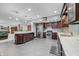 Spacious kitchen boasts stainless steel appliances, granite countertops and glass tile backsplash at 4128 Whitetail Woods Dr, Bargersville, IN 46106