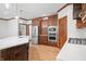 Stylish kitchen features stainless steel appliances, custom cabinetry, and a large island at 4128 Whitetail Woods Dr, Bargersville, IN 46106