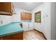 Well-lit laundry room with ample cabinet space, countertop, and a washer/dryer at 4128 Whitetail Woods Dr, Bargersville, IN 46106