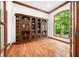 Office with custom built-in shelving and large window with private backyard views at 4128 Whitetail Woods Dr, Bargersville, IN 46106
