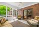 Inviting screened-in porch with ample seating and views of the beautifully landscaped backyard at 4128 Whitetail Woods Dr, Bargersville, IN 46106