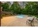 Backyard oasis featuring a pristine swimming pool with lounge chairs and lush green surroundings at 4128 Whitetail Woods Dr, Bargersville, IN 46106