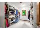 Spacious walk-in closet with custom shelves and hanging rods, perfect for storage at 4128 Whitetail Woods Dr, Bargersville, IN 46106