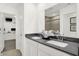 Elegant bathroom boasts dual sinks, modern fixtures, and a view of a walk-in closet and shower at 4405 Mendocino Blvd, Indianapolis, IN 46239