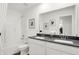 Bright bathroom featuring a dual-sink vanity with a gray countertop and shower-tub combo at 4405 Mendocino Blvd, Indianapolis, IN 46239