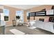 Bright ' bedroom with charming decor, bunk beds, and large windows offering a picturesque view at 4405 Mendocino Blvd, Indianapolis, IN 46239