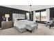 Luxurious main bedroom featuring a plush bed, stylish lighting, and a comfortable sitting area at 4405 Mendocino Blvd, Indianapolis, IN 46239
