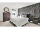 Stylish bedroom featuring a unique patterned wall, large window, and a comfortable bed at 4405 Mendocino Blvd, Indianapolis, IN 46239