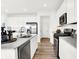 Contemporary kitchen boasts stainless steel appliances and a spacious center island with a sink and dishwasher at 4405 Mendocino Blvd, Indianapolis, IN 46239