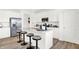Modern kitchen featuring white cabinetry, stainless steel appliances, and a center island with barstool seating at 4405 Mendocino Blvd, Indianapolis, IN 46239